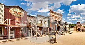 Vintage Far West town with saloon. Old wooden architecture in Wild West