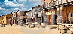 Vintage Far West town with saloon. Old wooden architecture in Wild West