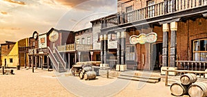 Vintage Far West town with saloon. Old wooden architecture in Wild West