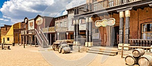 Vintage Far West town with saloon. Old wooden architecture in Wild West photo