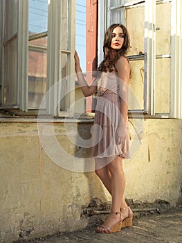 Vintage fashion portrait young woman old house