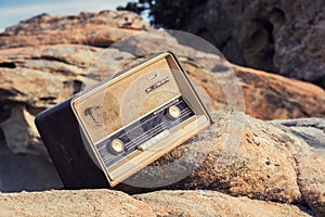 Vintage fashioned old radio on the beach