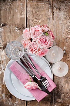 Vintage festive table setting with pink roses