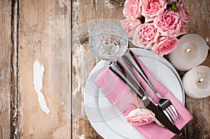 Vintage festive table setting with pink roses