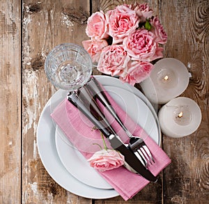 Vintage festive table setting with pink roses