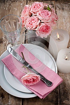 Vintage festive table setting with pink roses
