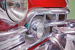 Vintage fifties red classic car with chrome accents