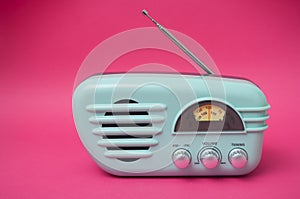 vintage fifties style radio on pink background