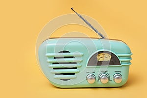 vintage fifties style radio on yellow background