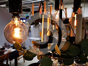 Vintage filament light bulb and candles photo