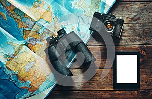 Vintage Film Camera, Map, Tablet And Binoculars On Wooden Table, Top View. Adventure Travel Scout Journey Concept