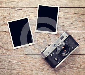 Vintage film camera and two blank photo frames