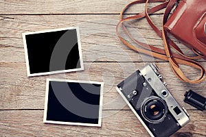 Vintage film camera and two blank photo frames