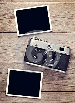 Vintage film camera and two blank photo frames