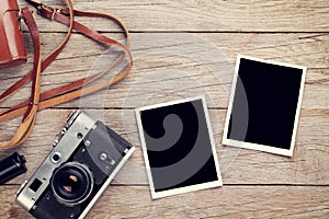 Vintage film camera and two blank photo frames