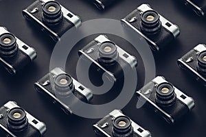 Vintage Film Cameras On Black Background Surface. Creativity Retro Technology Concept
