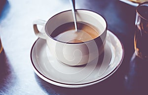 Vintage filter : Thailand Local coffee in cup on table,street ca