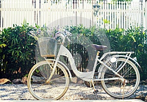Vintage filtered: Bicycle parking in house outdoor, classic bike in the garden