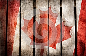 Vintage filtered,Canada national flag on wood background.