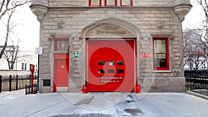 Vintage Firehouse in City bright red Doors & Brick wall photo