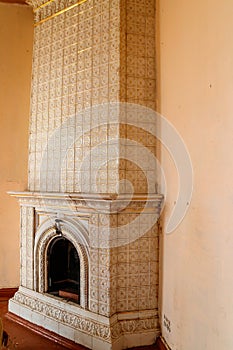 Vintage fireplace in living room of abandoned palace