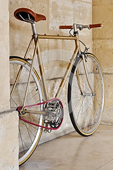 Vintage fixie with a pink chain