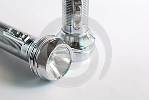 Vintage flashlight isolated on white background.