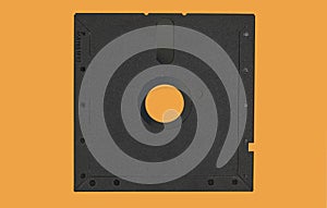 Vintage Floppy Disk 5.25 inch. Retro storage technology isolated on orange background