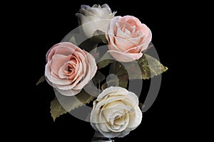 Vintage flower style,pink rose and white rose on black background,made of cloth