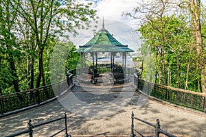 Vintage forged gazebo in a spring park