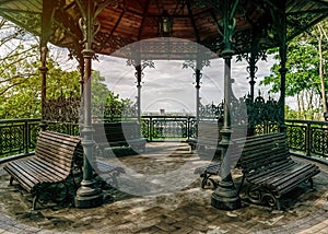 Vintage forged gazebo in a spring park