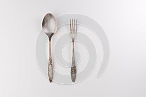 Vintage fork and spoon on white