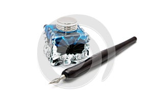 Vintage fountain pen and inkwell isolated