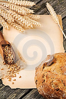 Vintage frame with bread loaf and wheat