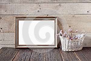 Vintage frame mockup on a wooden background