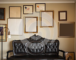 vintage forniture in a livingroom with empty frames photo