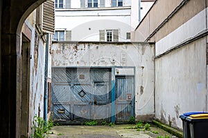 Vintage garage inscription on the old rusty door in central Strasbourg