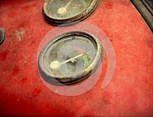 Vintage gauges  on the dashboard of an old tractor. Control and measurement concept image