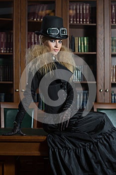 Vintage girl next to the bookcase, gothic