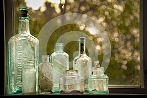 Vintage Glass Bottles In Window