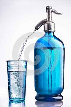 Vintage glass and siphon of water