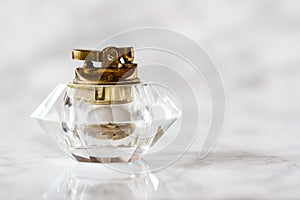 Vintage Glass Table Lighter on White Marble Background