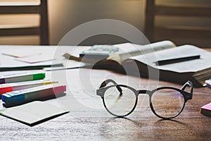 Vintage glasses on books stack in public library book, Studying examining learning People  learning education