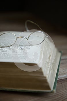 Vintage glasses resting on an old book