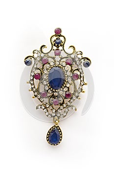 Vintage gold brooch with precious stones isolated on white