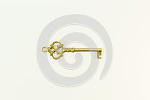 Vintage gold key on white background