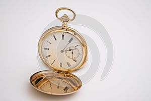 vintage gold pocket watch longines isolated on white background,