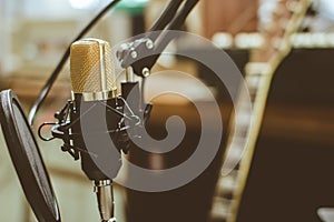 Vintage with golden condenser microphones in the recording room