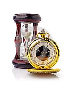 Vintage golden pocket watch and wooden hourglass