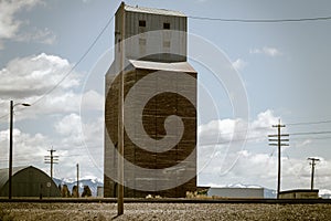 Vintage Grain Elevator Next to Railroad Tracks